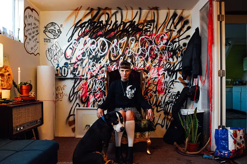 Image: Robyn Francis, who uses the moniker Grow Love, in her space at Artuvus Studios; she’ll be live painting at Artopia.
