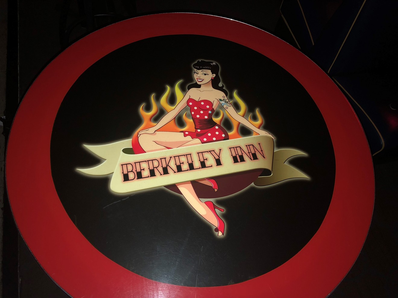 The Berkeley Inn logo can be found on tabletops throughout the bar, as well as on the sign outside.