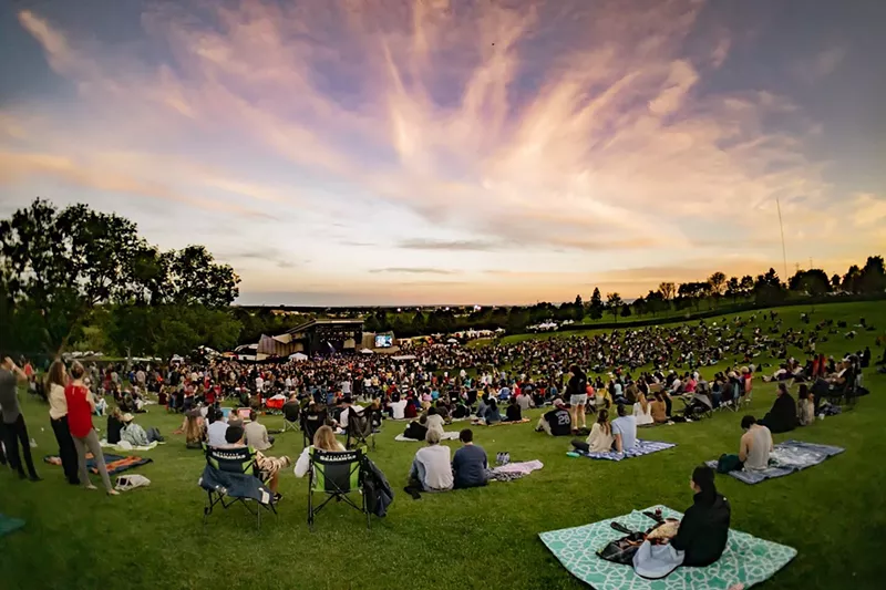 Image: people picnicking at an outdoor venue in the summer