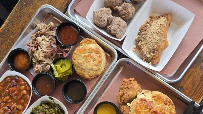 barbecue meat and sides on trays