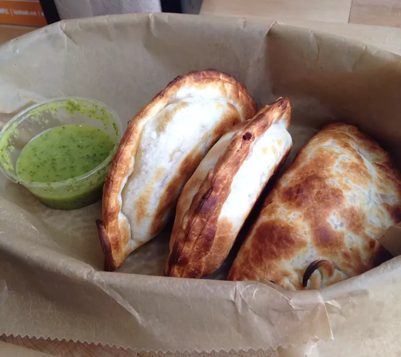 Image: three empanadas in a basket