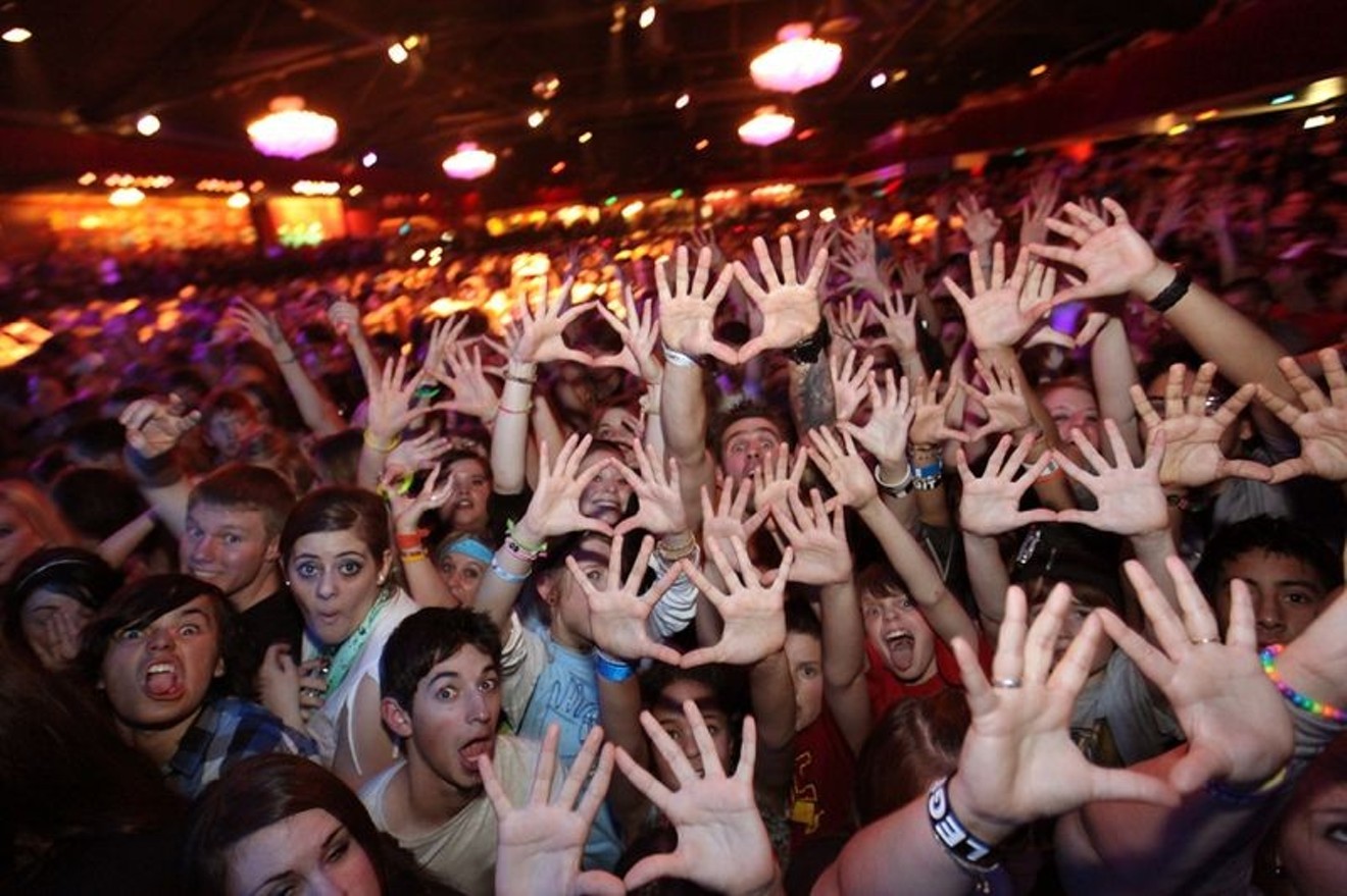 3OH!3 fans flash the band's hand symbol.