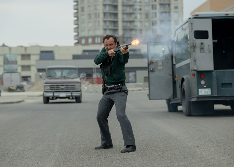 Image: Jude Law takes aim in The Order, playing in the Denver Film Festival.