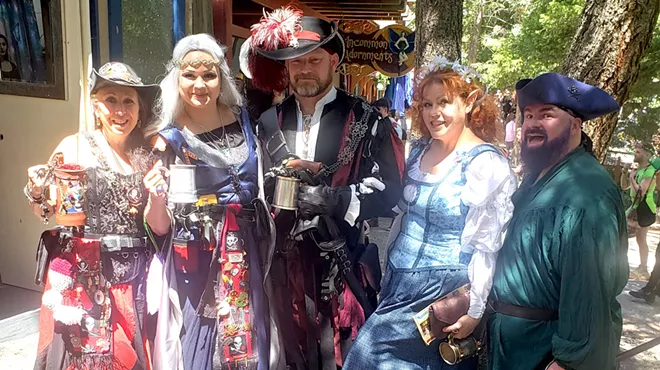 A group of people in Renaissance Festival outfits.