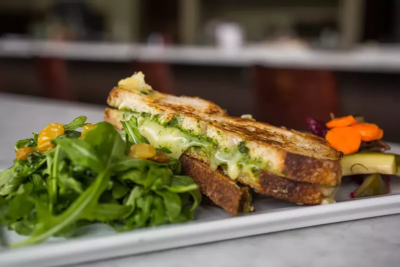 Image: Herb pesto and cheddar grilled cheese at Truffle Table.