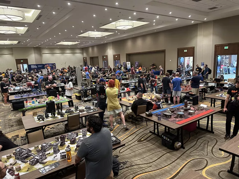 Image: A crowded room of tabletop gamers