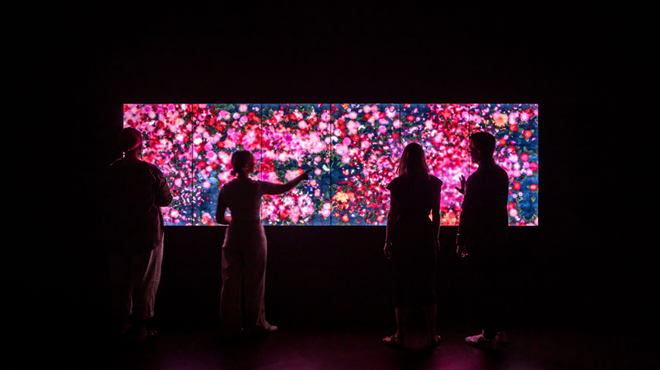 people interacting with an led screen