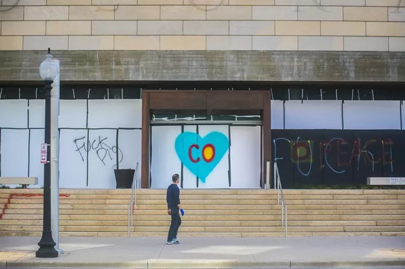 Image: A cleanup volunteer painted the heart on the History Colorado Center.