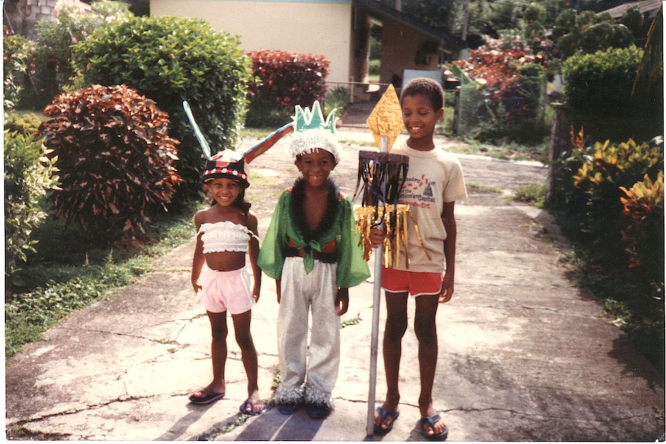 Director Damani Baker with his younger sister Kai (left) and a neighbor in Grenada in 1983.