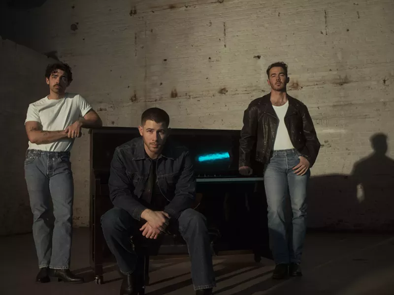 Image: members of the Jonas Brothers looking moody