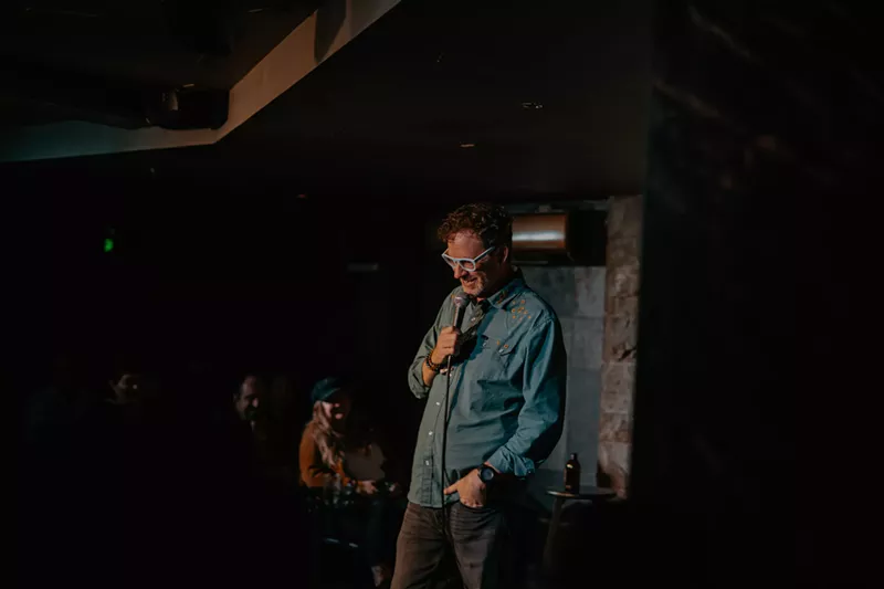 Image: A man performs onstage.