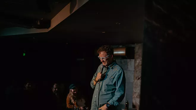 A man performs onstage.
