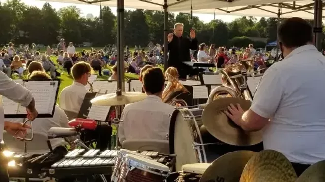 people watching the Denver Municipal Band outdoors