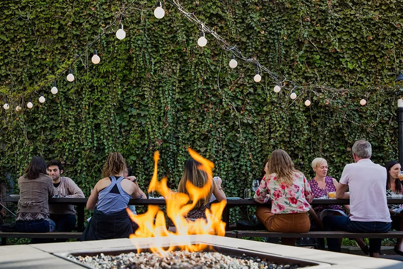 Image: There are very few summer nights left for dinner on the Populist's secluded patio.