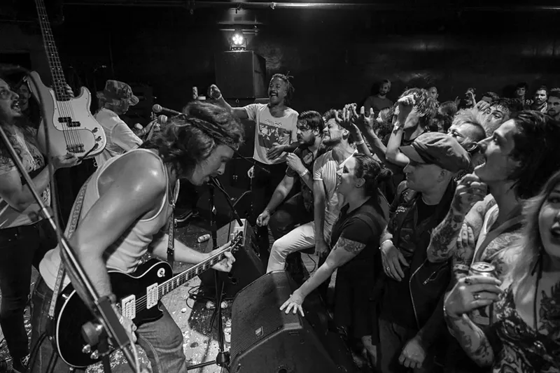Image: view of a band performing on stage