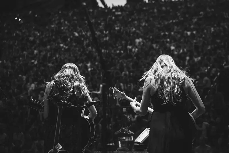 Image: The Shook Twins face a crowd of thousands at Red Rocks.