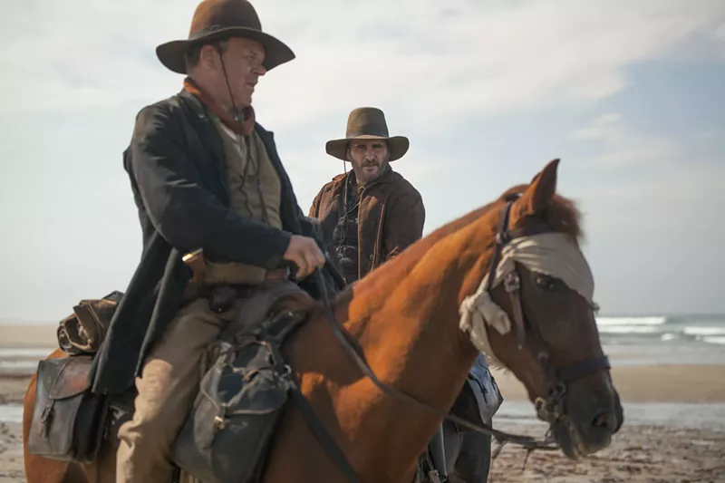 Image: John C. Reilly (left) plays Eli and Joquain Phoenix is Charlie in The Sisters Brothers, French director Jacques Audiard's film that brings something fresh to a Western — a genuine depiction of sibling love.