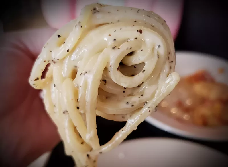 Image: This satiny spaghetti cacio e pepe is one of the four courses on Coperta's pasta tasting menu.