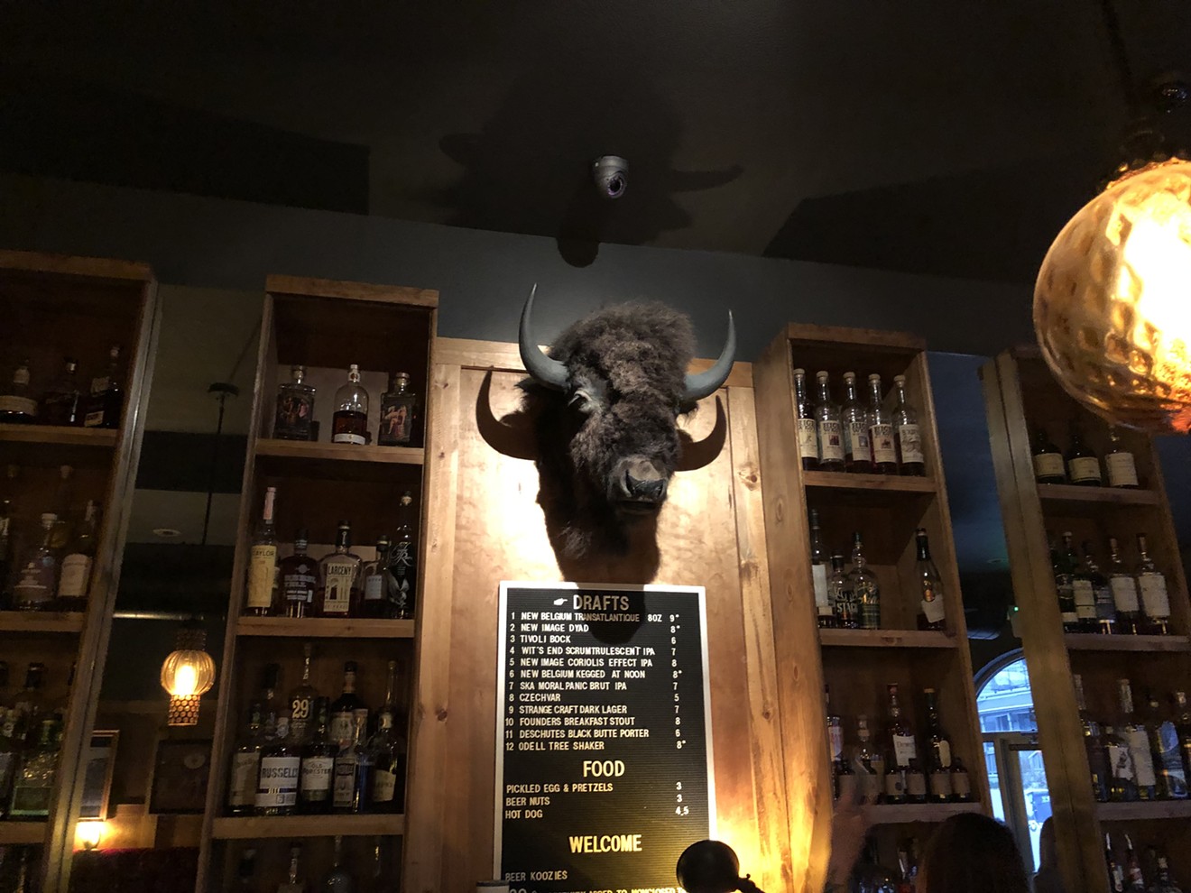 The bison behind the bar at High Lonesome is here to oversee your bourbon consumption.