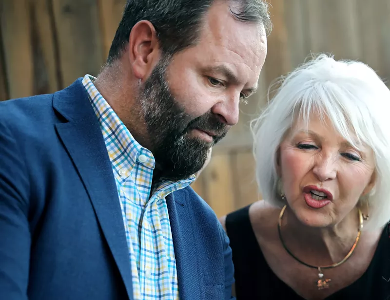 Image: man with beard in jacket with blonde woman