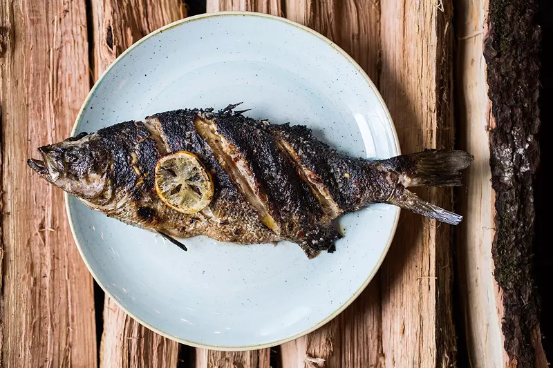Image: Whole fish can be a tough sell, but Fish N Beer flies through its wood-grilled seafood.