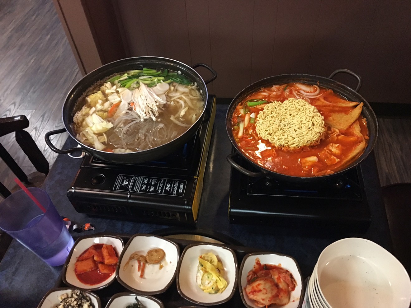 The bulgogi and octopus stew (left) and stir-fried rice cakes are both good orders at Shin Myung Gwan.