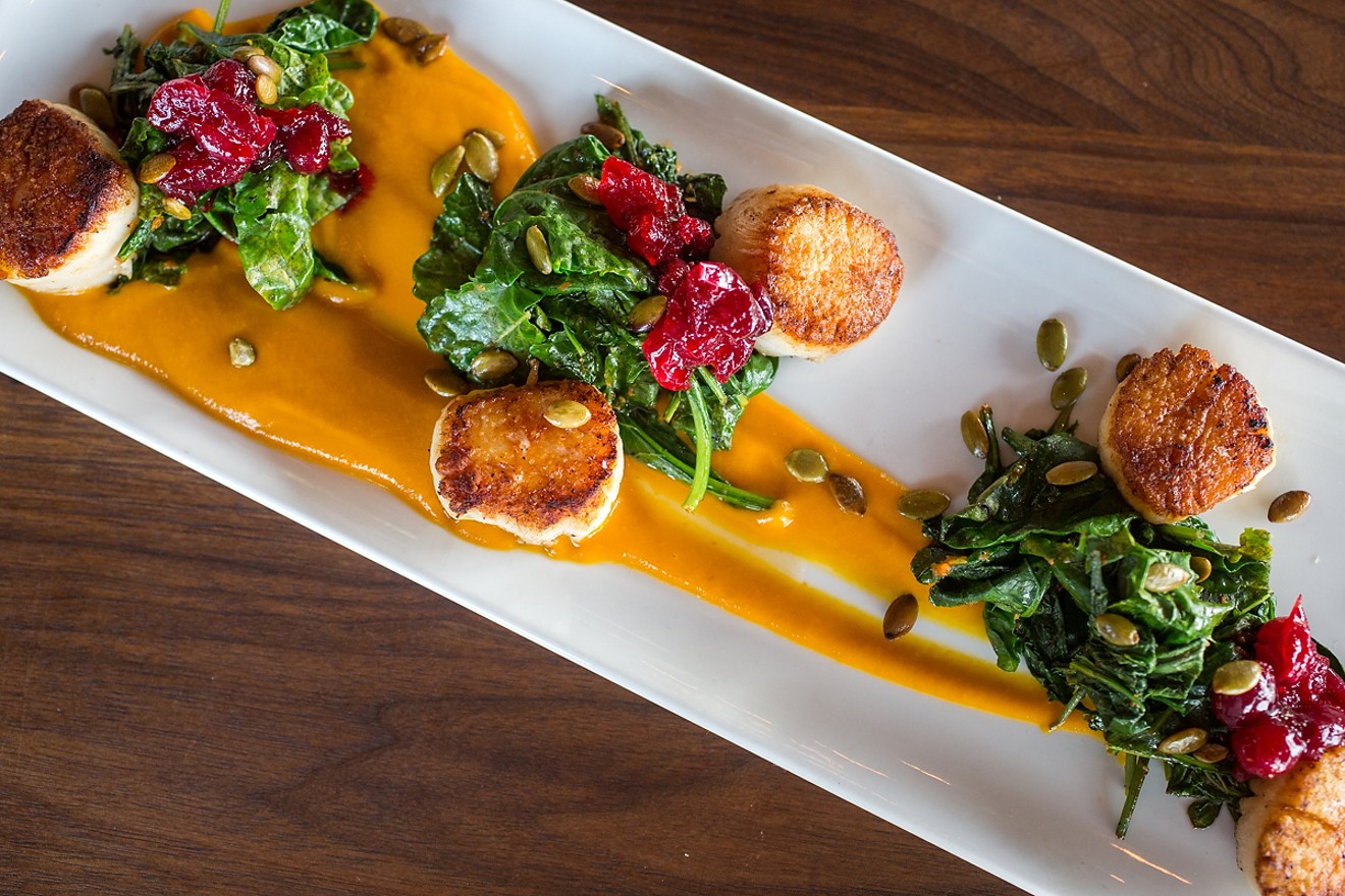 Diver scallops with curried kuri squash, kale and cranberries - a plate as stunning to behold is it is delicious to eat.