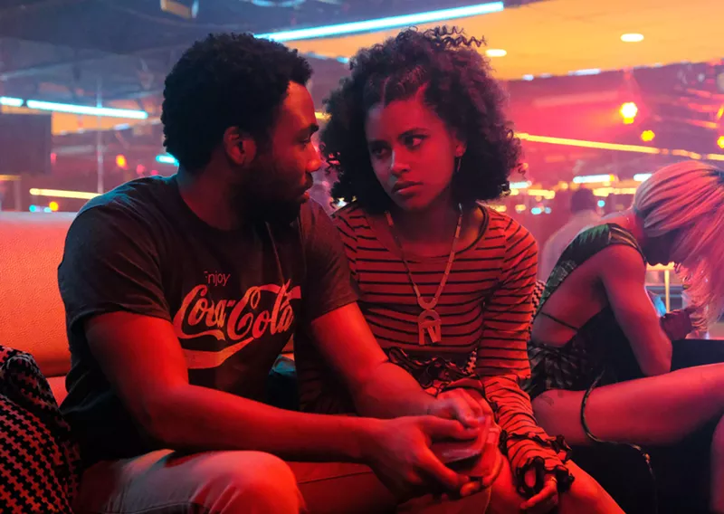 Image: Donald Glover (left), the creator, co-writer and star of the FX series Atlanta, appears in a scene with Zazie Beetz.