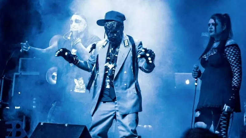 Image: A masked Christian Gulzow on stage with the Undertakers.