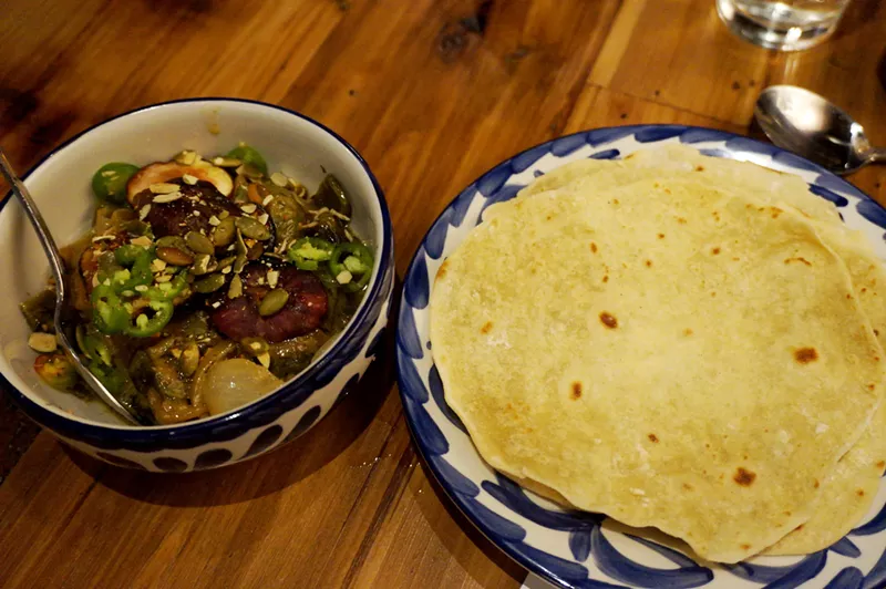 Image: Housemade flour tortillas with roasted poblanos and figs at El Jefe.