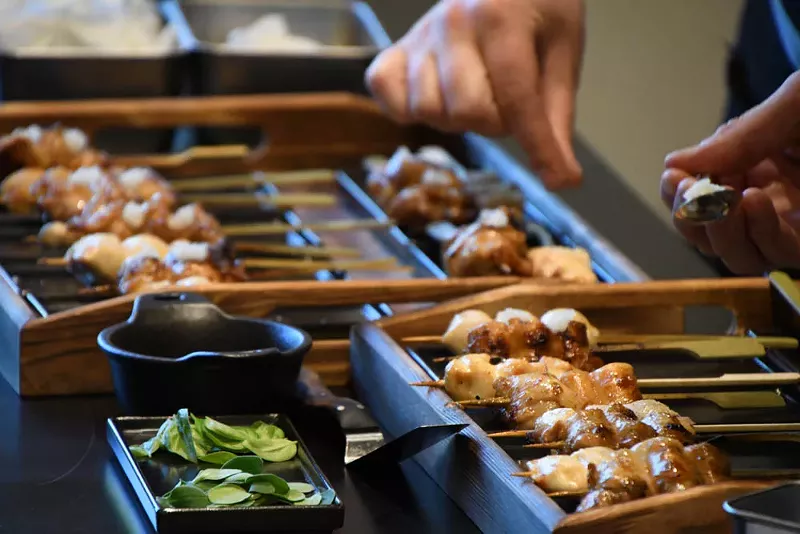 Image: Sit at the bar at the Wolf's Tailor and enjoy a skewer tasting menu.