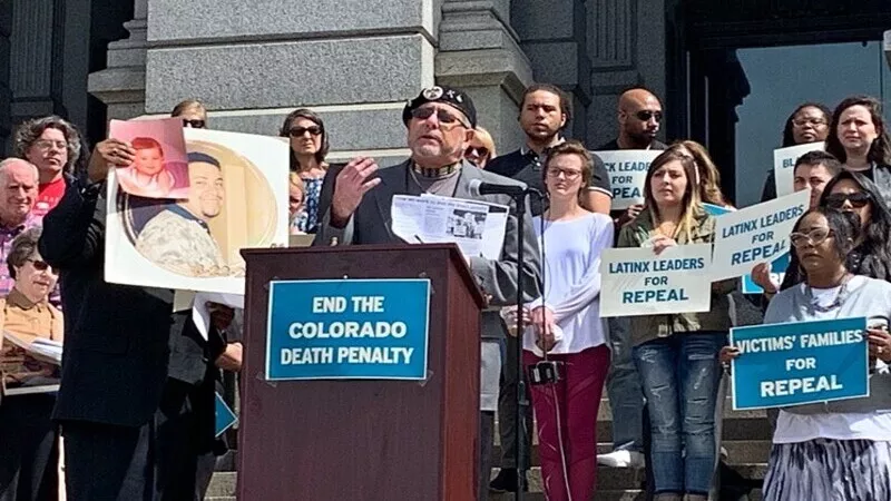 Image: Bob Autobee speaks at a rally opposing the death penalty.