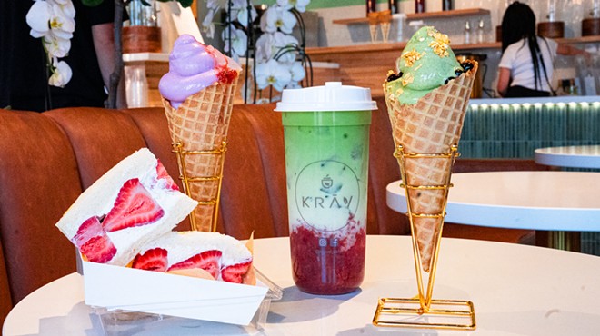 two waffle cones, a strawberry and cream sandwich and a boba drink