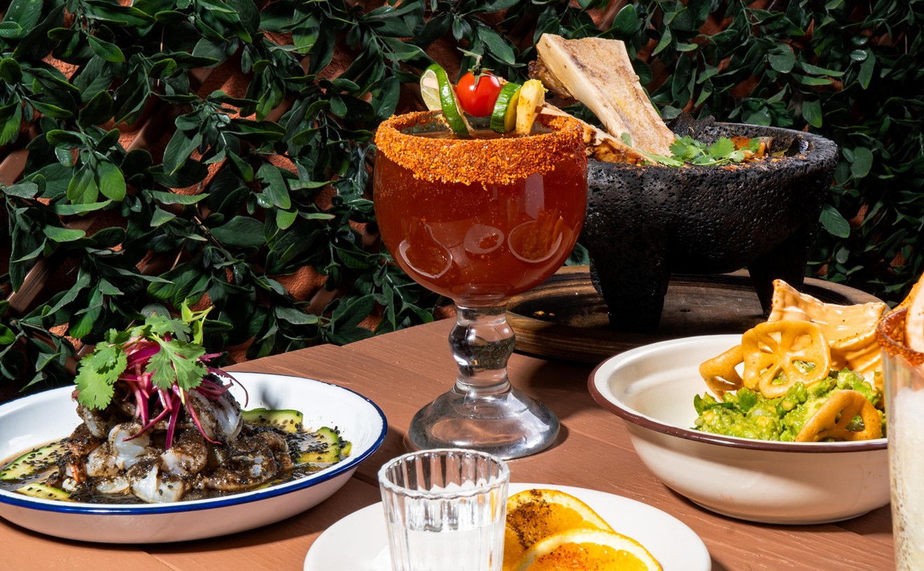 Michelada and various dishes on a table