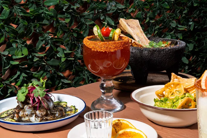 Image: Michelada and various dishes on a table