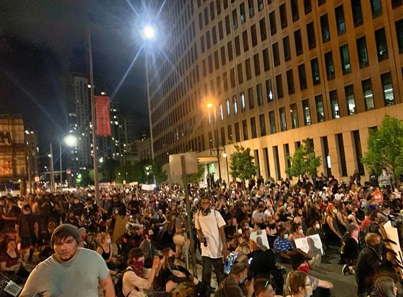 Image: Thousands of protesters took a knee or sat in silence for nine minutes at 20th and Curtis streets.