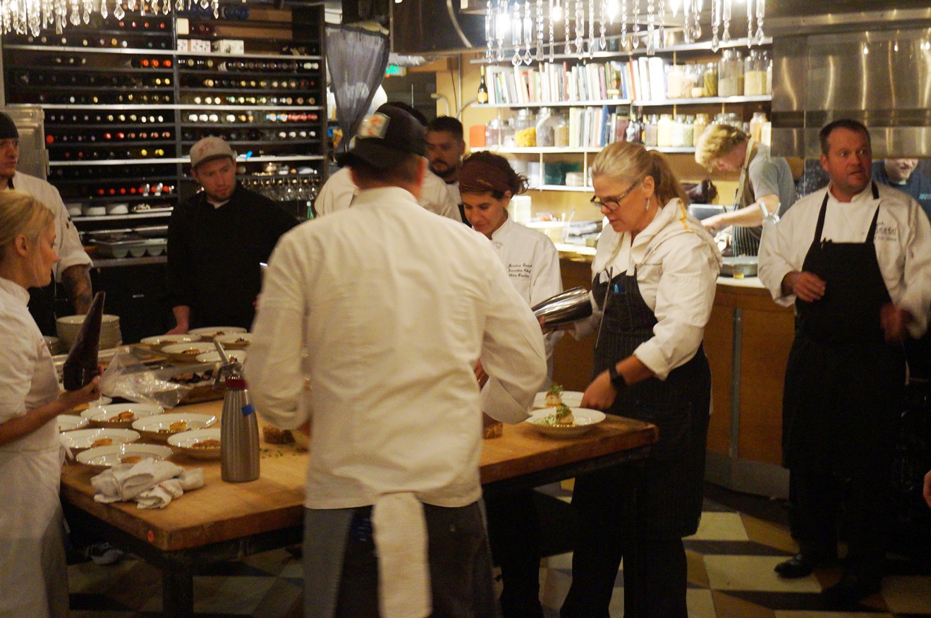 Chefs, including Jennifer Jasinski (a previous James Beard Award winner) and Eric Skokan (far right), prep for a James Beard dinner last fall.