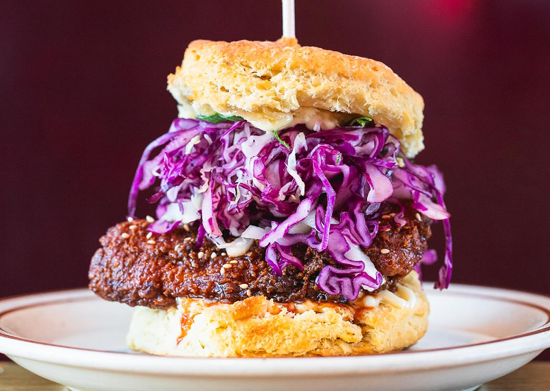 Image: a biscuit sandwich with fried chicken and cabbage