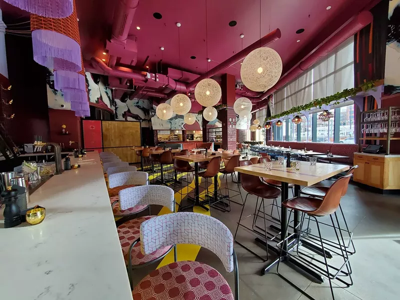 Image: interior of a restaurant with a pink ceiling