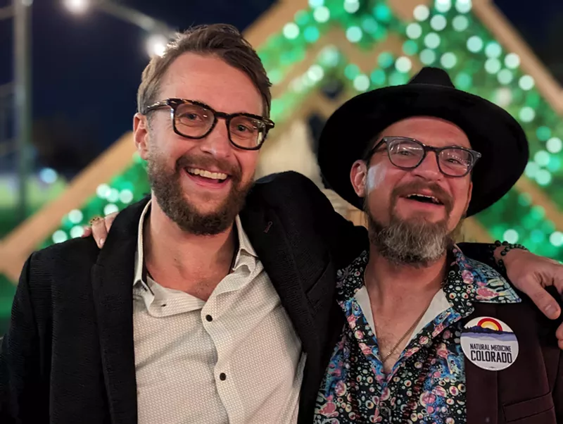 Image: Joshua Kappel (left) and Kevin Matthews of Natural Medicine Colorado celebrate on November election night.