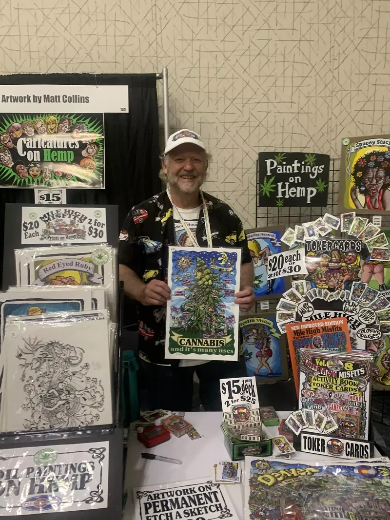 Image: Matt Collins poses with his artwork at the NoCo Hemp Expo.
