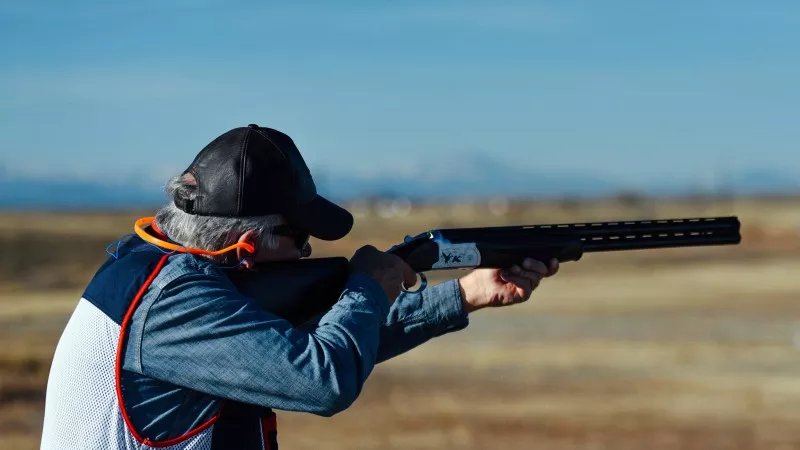 Image: Tom Tancredo squeezing the trigger in a photo from the recent slideshow "How Some of Colorado's 2018 Gubernatorial Candidates Relax."