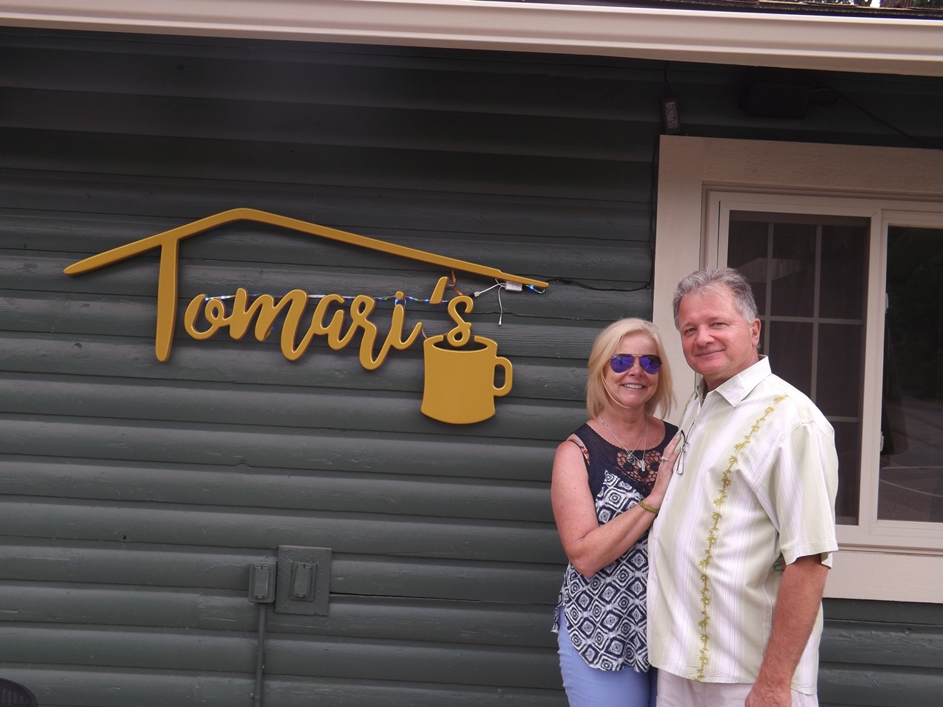 Mary Ellis and her husband, Tom Miszewski, in front of their new coffee shop.