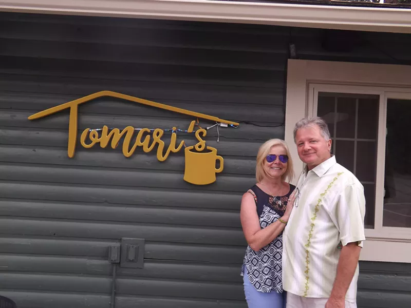 Image: Mary Ellis and her husband, Tom Miszewski, in front of their new coffee shop.