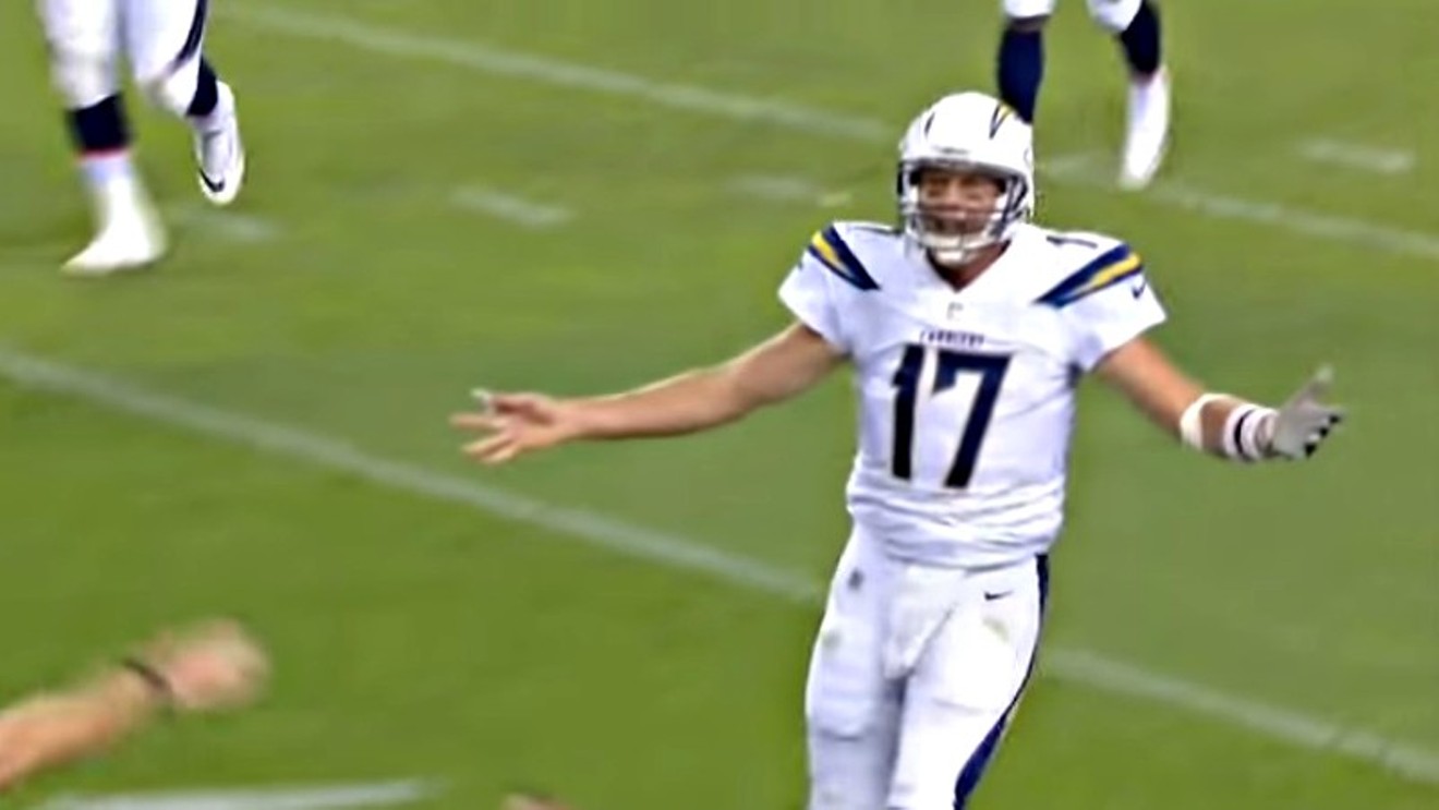 Los Angeles Chargers quarterback Philip Rivers complaining (naturally) after an interception by the Broncos' Bradley Roby.