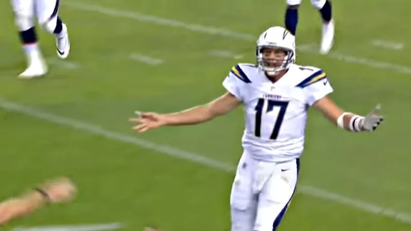 Image: Los Angeles Chargers quarterback Philip Rivers complaining (naturally) after an interception by the Broncos' Bradley Roby.
