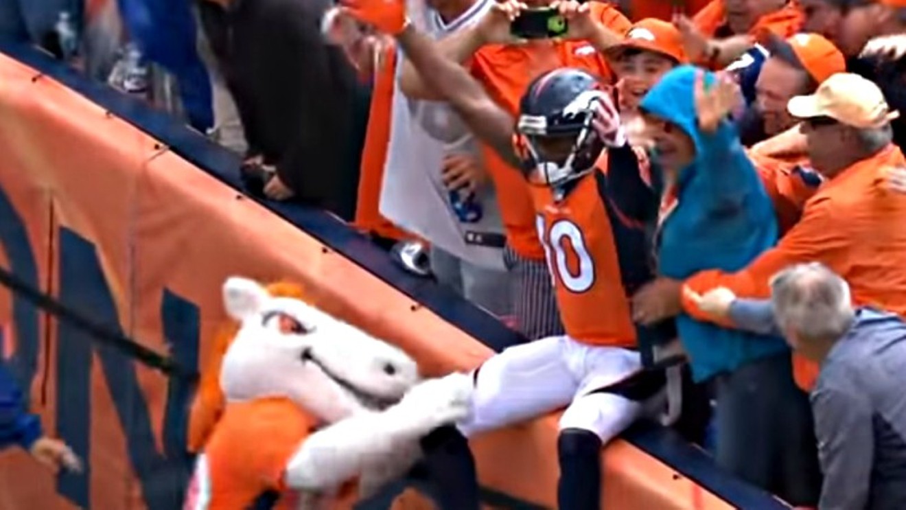 The Broncos' Emmanuel Sanders celebrates a touchdown with fans and mascot Miles on September 17 at Mile High Stadium.