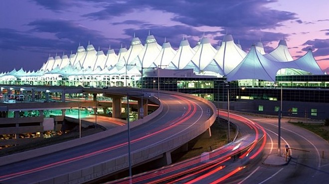 Denver International Airport lit up at night.