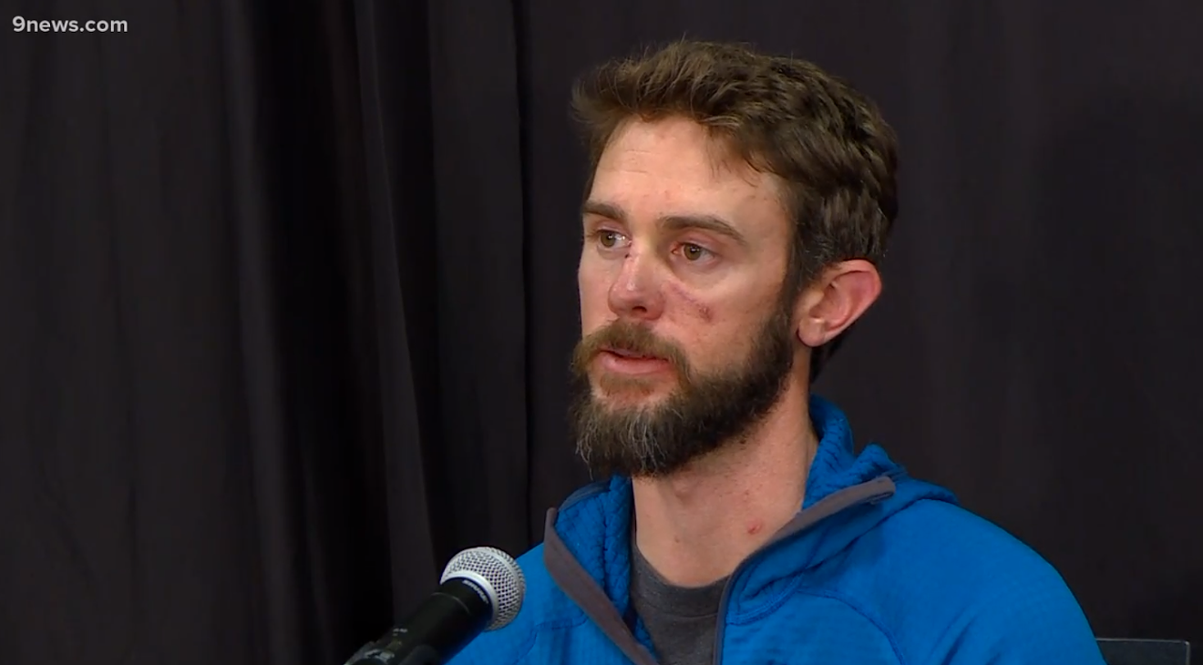 Travis Kauffman wore the same sweater he had on the day he fought off a mountain lion at a press conference in which he described his near-death experience.