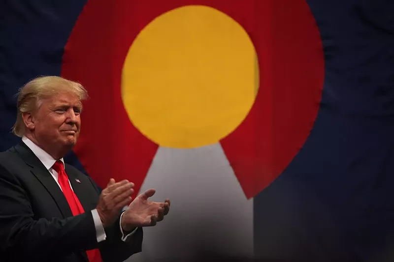 Image: donald trump in front of Colorado flag
